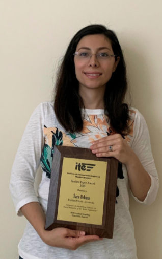 Sarah Urbina holding her OR ITE award plaque