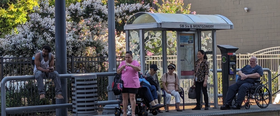 People waiting at bus stop.jpg